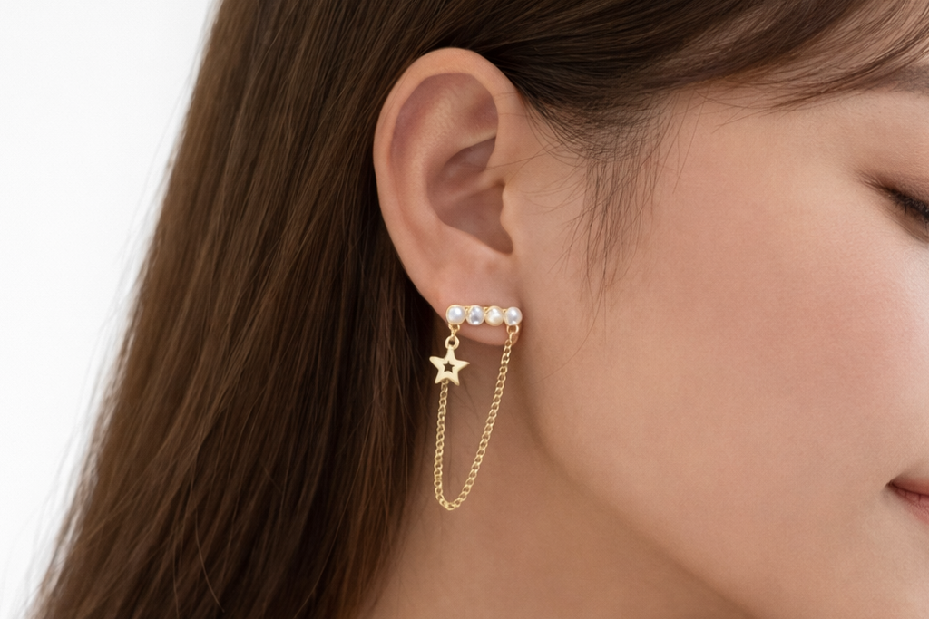 Ourums Gold Star Chain Earrings